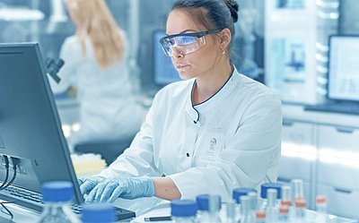 Female Axinon system user in laboratory environment 
